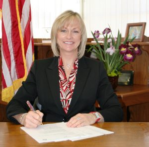 Terri Gonzalez as Warden at CMC.