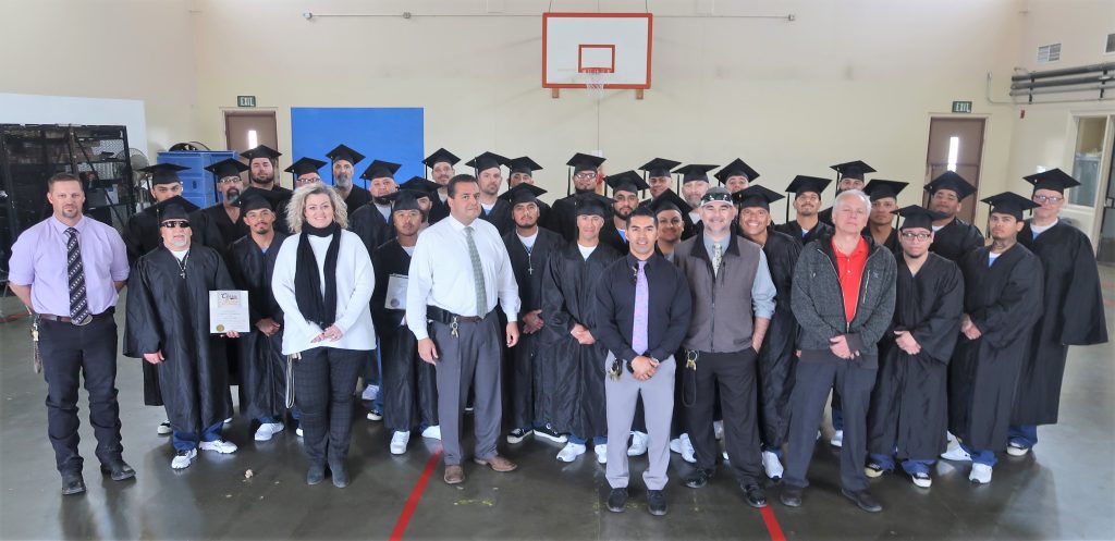 ASP high school diploma program recipients and prison staff.