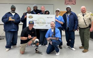 Incarcerated men and an oversized check.