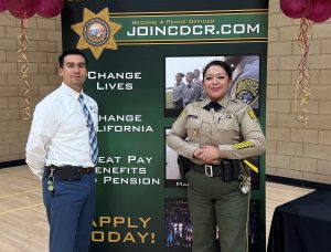 Recruiters from North Kern State Prison (NKSP) with a Join CDCR banner behind them.