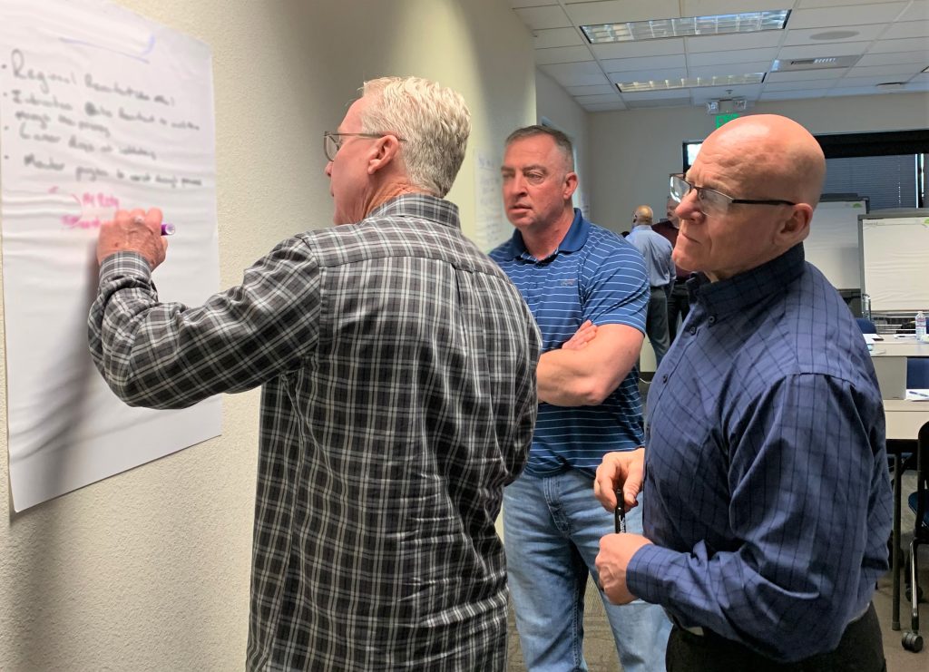 Workers brainstorm ideas to speed up the hiring process for correctional officers.