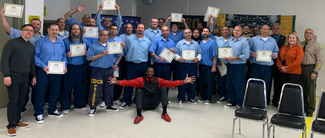 ARC graduation at Pleasant Valley State Prison with incarcerated people and prison staff.