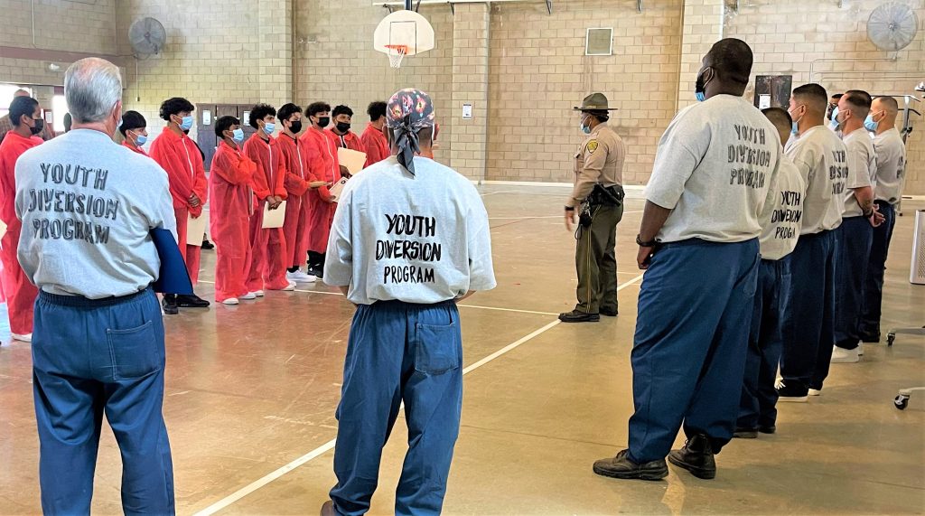 A graduation type of ceremony for completing the Youth Diversion Program with incarcerated mentors and prison staff.