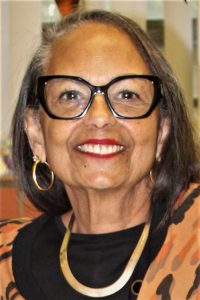 Parole agent Robin Hatter wearing glasses and a necklace.