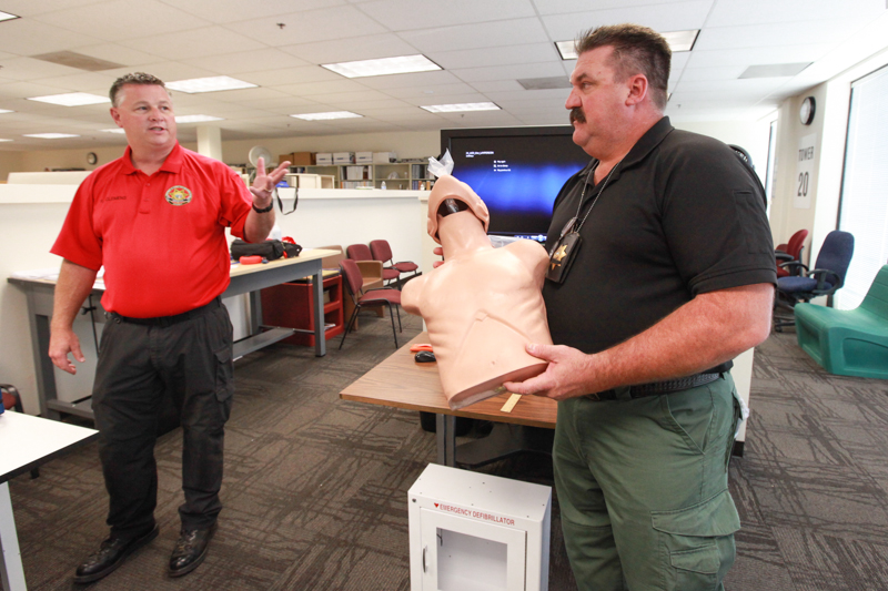 Instructors with a CPR dummy.