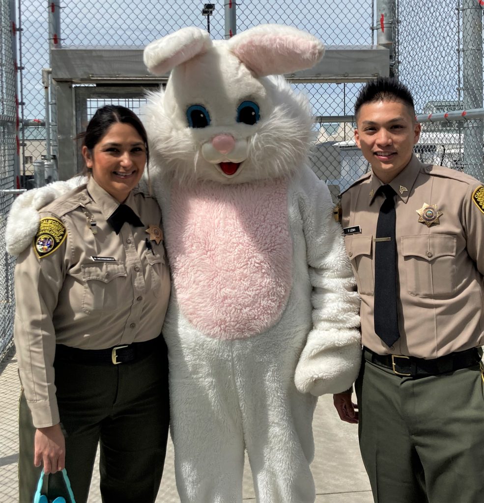 Correctional staff with the Easter Bunny.