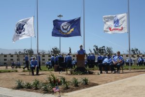 CDCR Unlocked podcast focuses on incarcerated veterans and services for them. Image shows flags and veterans during Memorial Day.