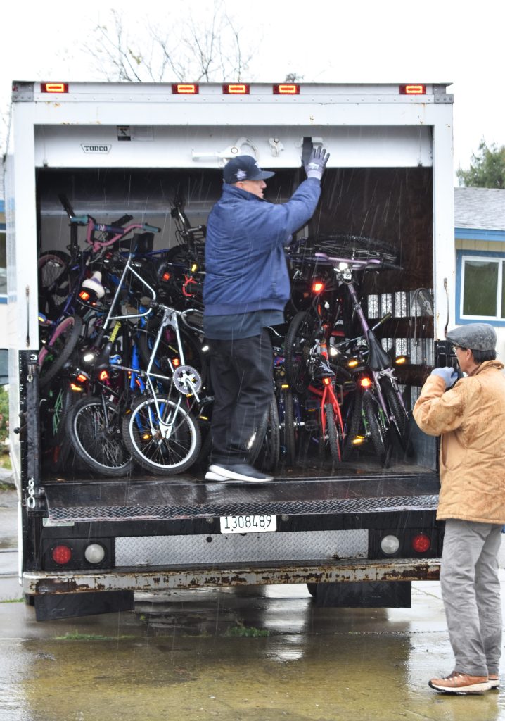 Bikes in the back of a box truck.
