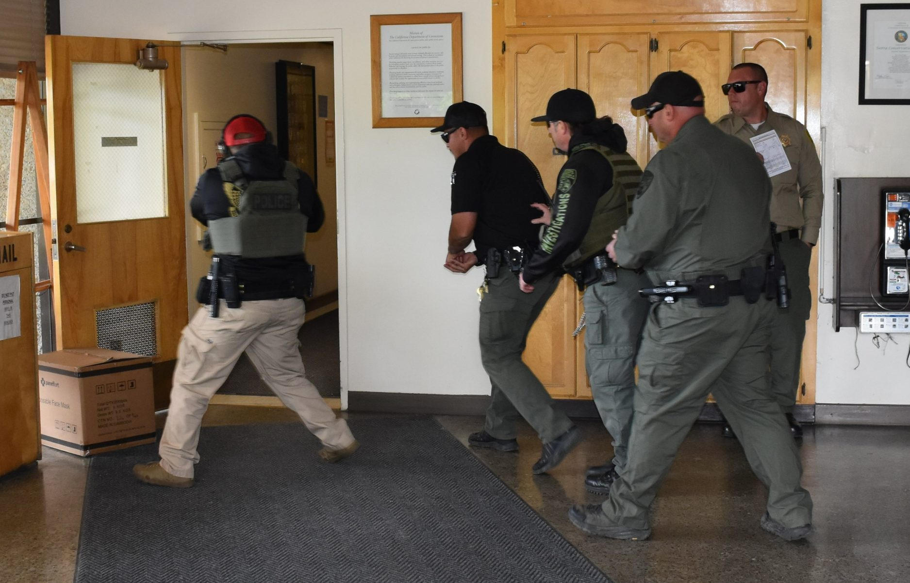 custody staff approaching door at SCC active shooter training