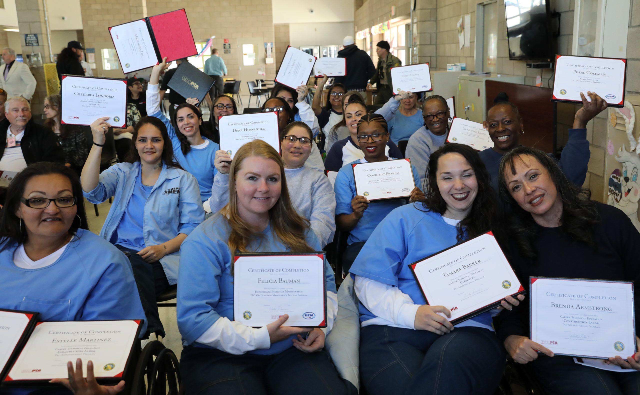 20 CCWF graduates holding certificates