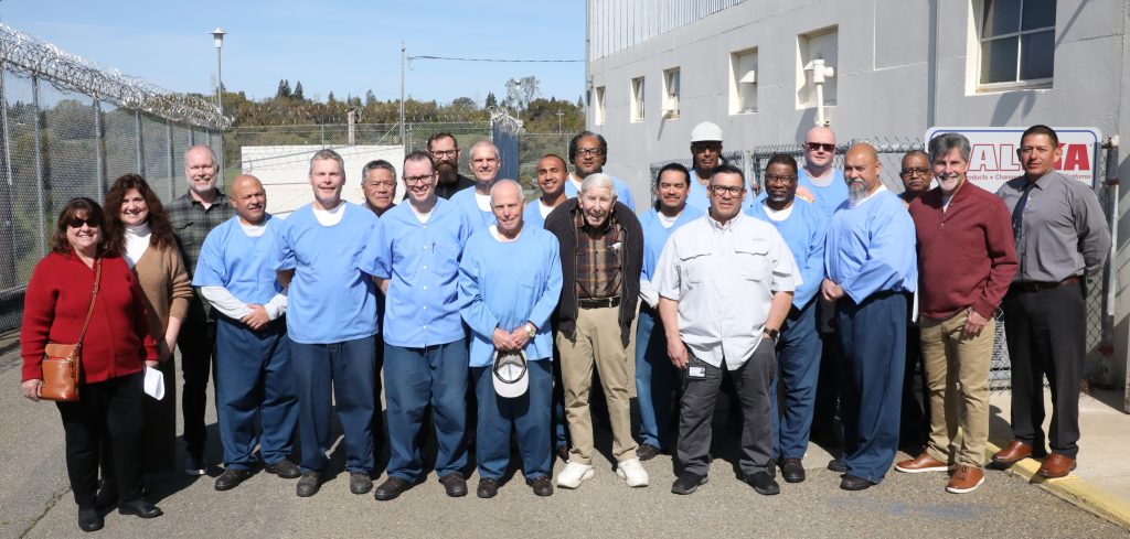 Incarcerated men with visitors at Folsom State Prison.