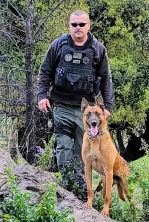 Correctional officer and a K-9.