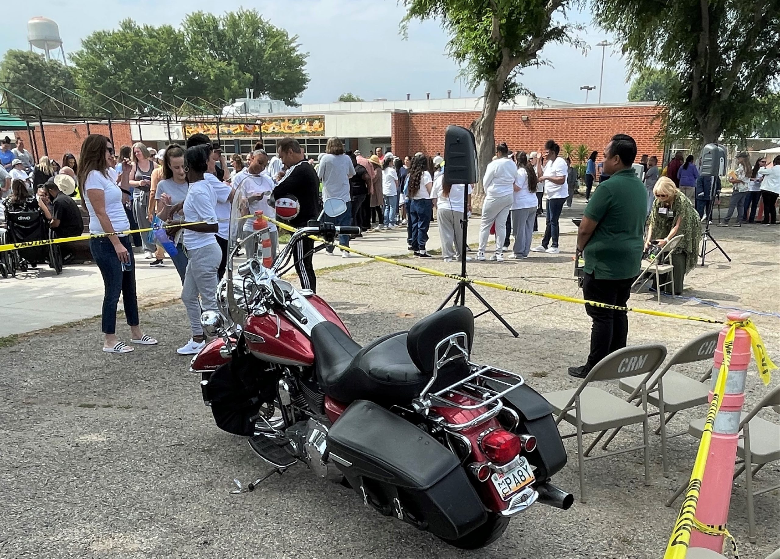 Motorcycle with incarcerated people at California Institution for Women (CIW).