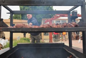 Man grills tri-tip at the CMC staff appreciation barbecue event.