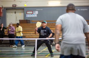 CMF warden plays pickleball with incarcerated people.