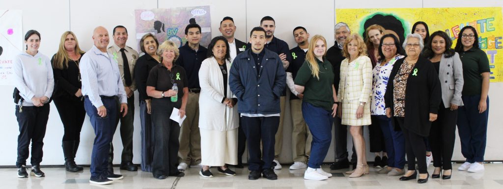 Incarcerated youth, correctional staff and guests at a victims' event.