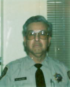 Correctional officer wearing glasses.