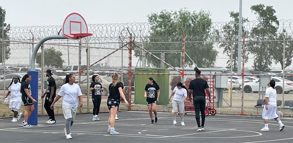 Basketball players enjoy a game with the incarcerated population at California Institution for Women.