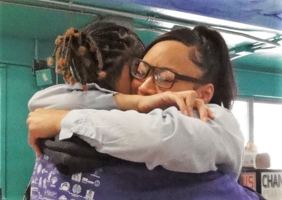 Two people hugging at California Institution for Women.