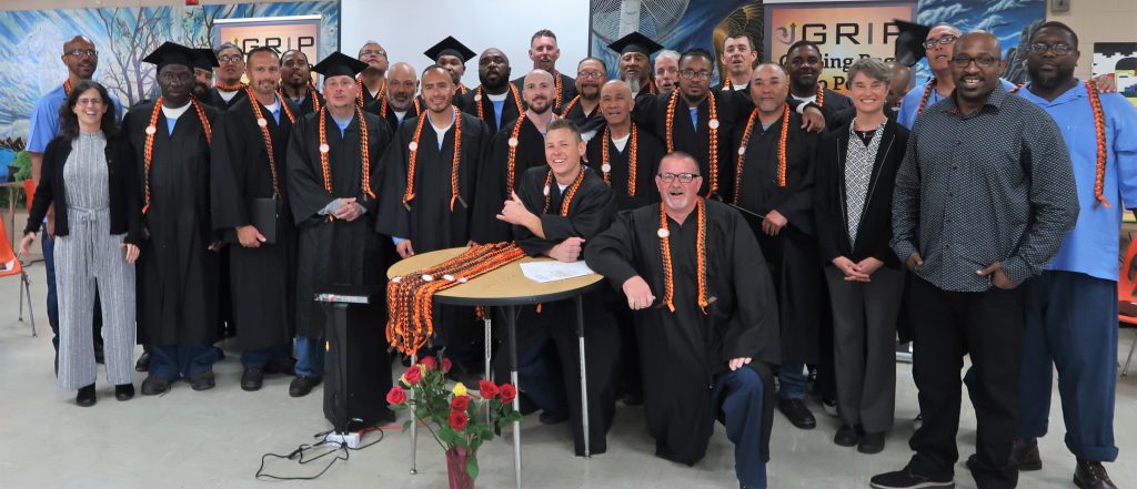 Incarcerated people gathering at a graduation.