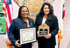 Danielle Bourgeois with Julie Kaplan, both holding an award.