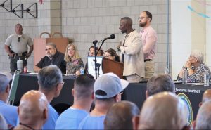 man speaking at podium VSP National Crime Victims' event