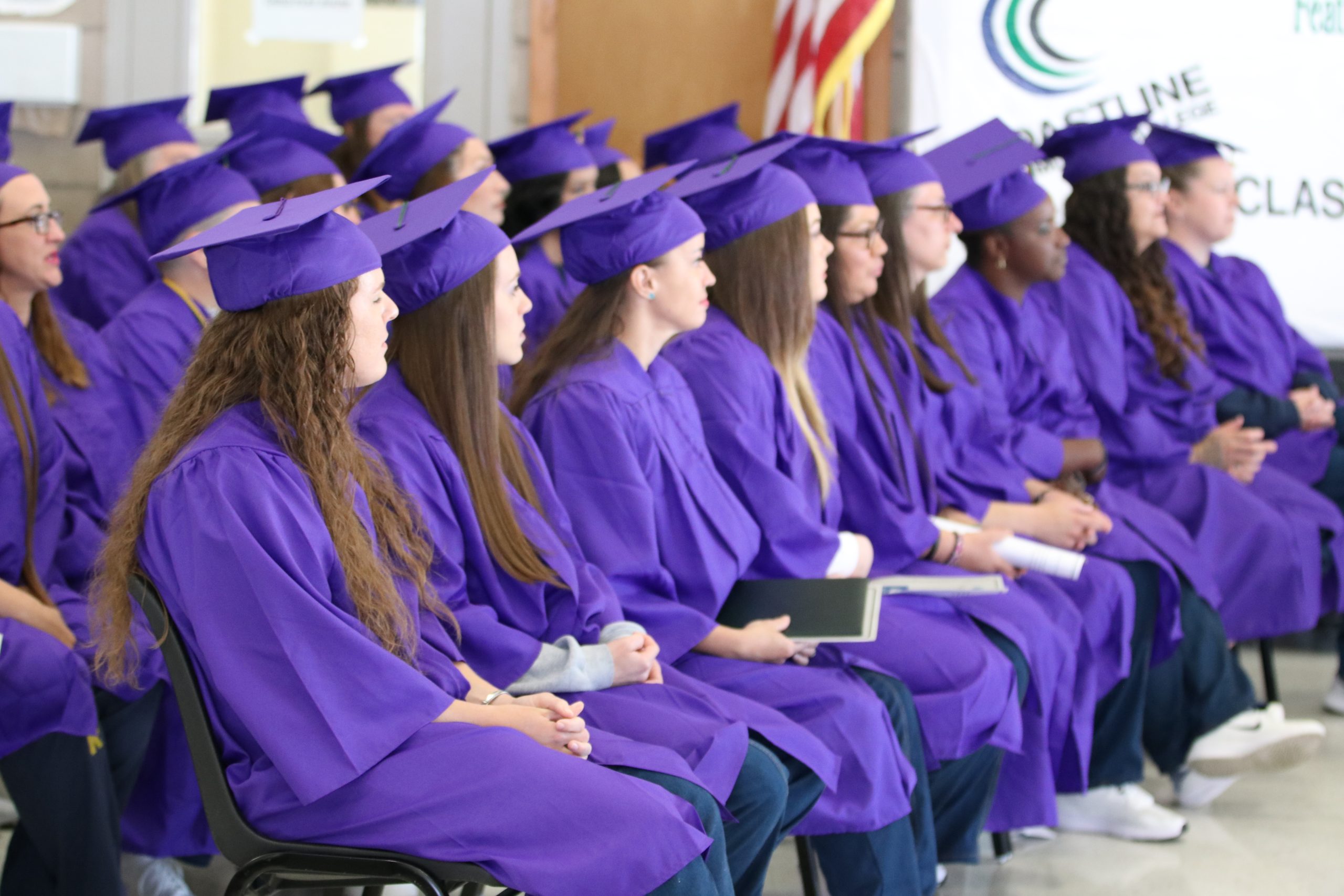 ccwf graduates sitting together at the ceremony