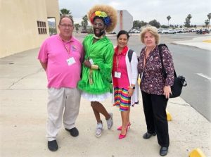 Four people outside of RJD Correctional Facility to mark Pride festivities.