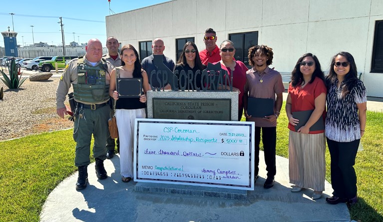 COR scholarships totaling $5,000 with students and staff at the prison.
