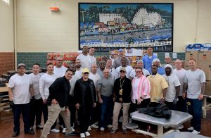 Correctional Training Facility (CTF) incarcerated population and a staff member at a food sale fundraiser to benefit and arts center.