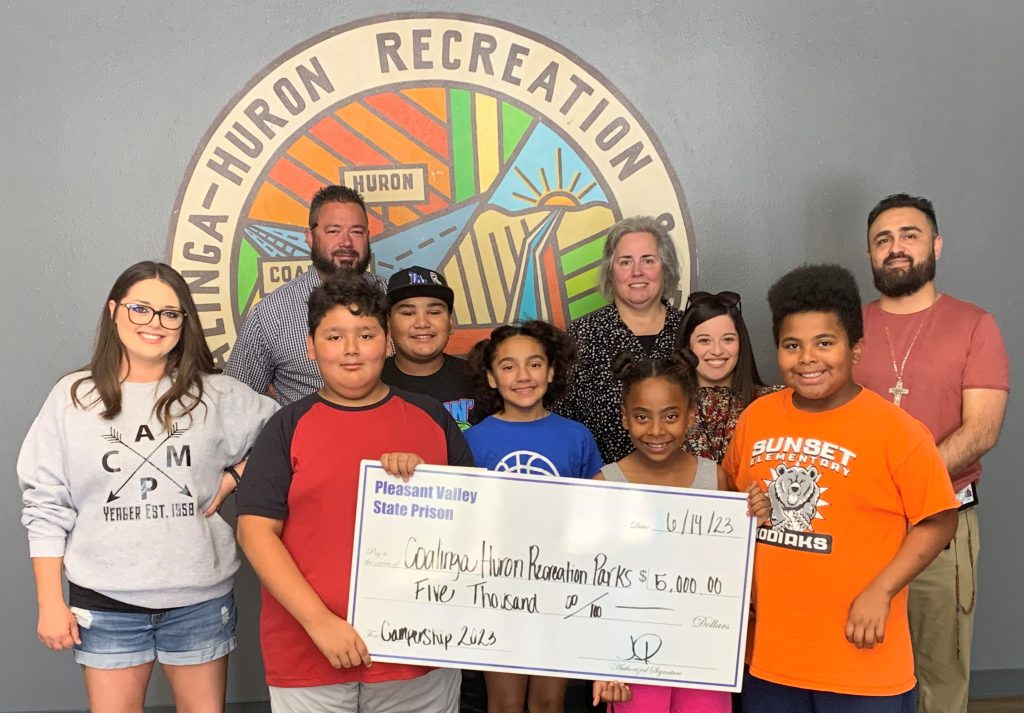 Camp Yeager attendees holding donation check PVSP summer camp