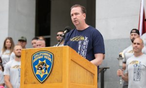 Secretary Macomber delivers speech prior to the start of the special olympics torch run