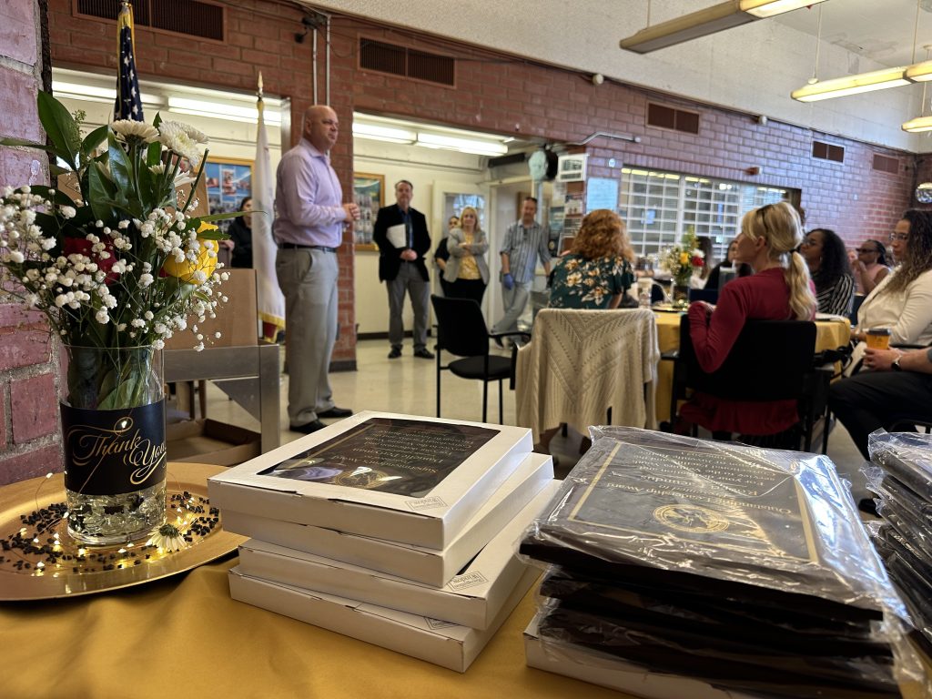 Plaques on a table during a luncheon at Ventura Youth Correctional Facility.