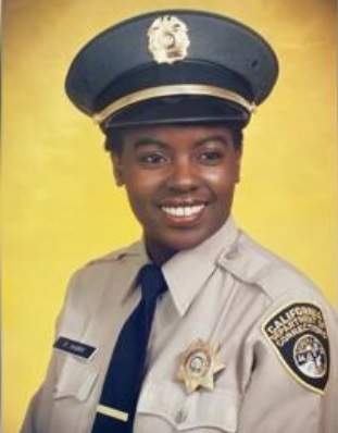 Frances Ivory wearing a correctional officer uniform.