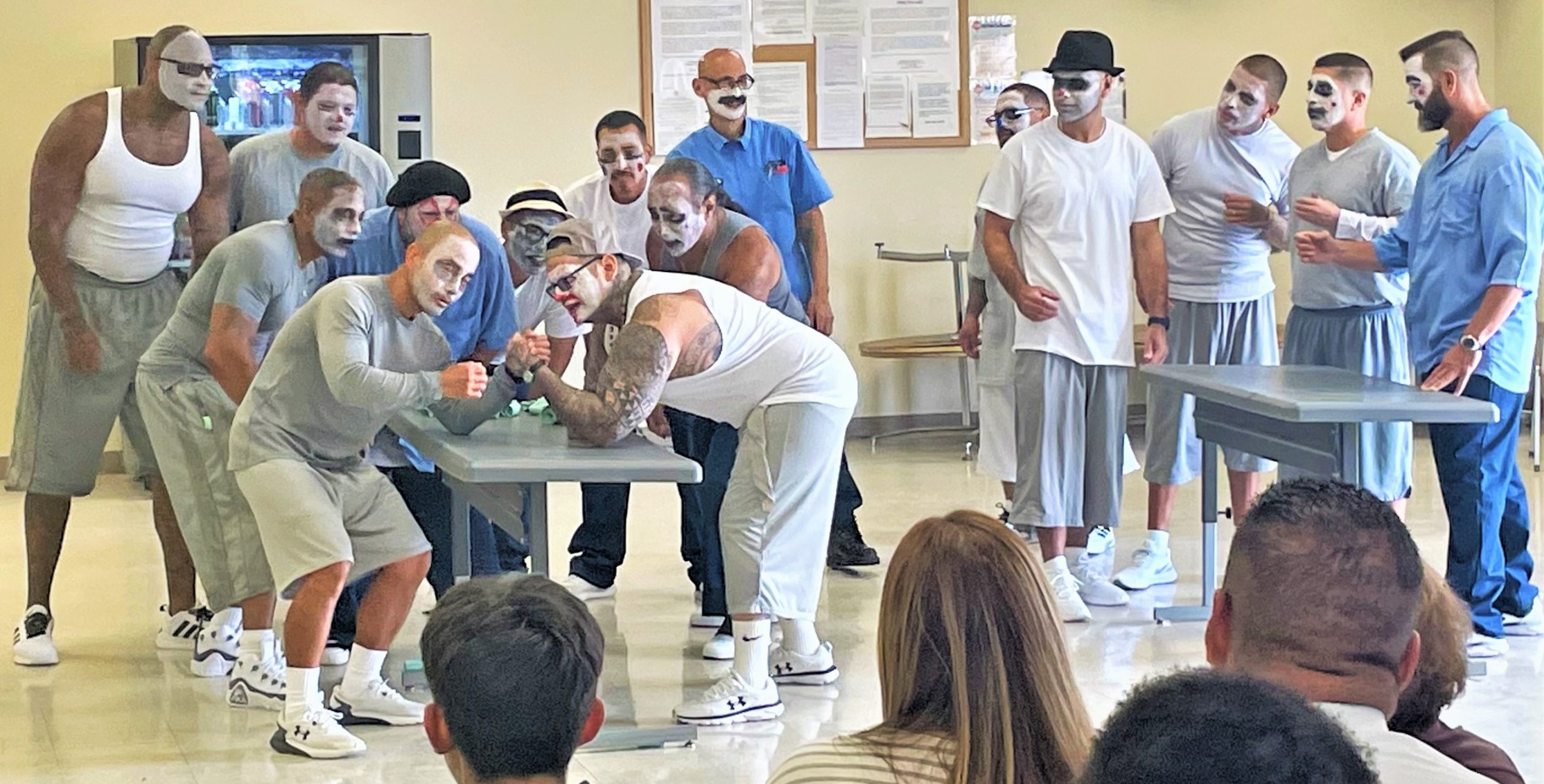 Actors' Gang at Avenal State Prison (ASP) with multiple incarcerated people wearing stage makeup while performing.