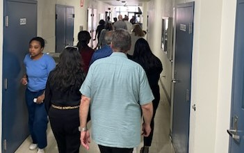group walking down a hallway