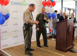 Rob Kettle, associate warden, is presented an award by the warden.