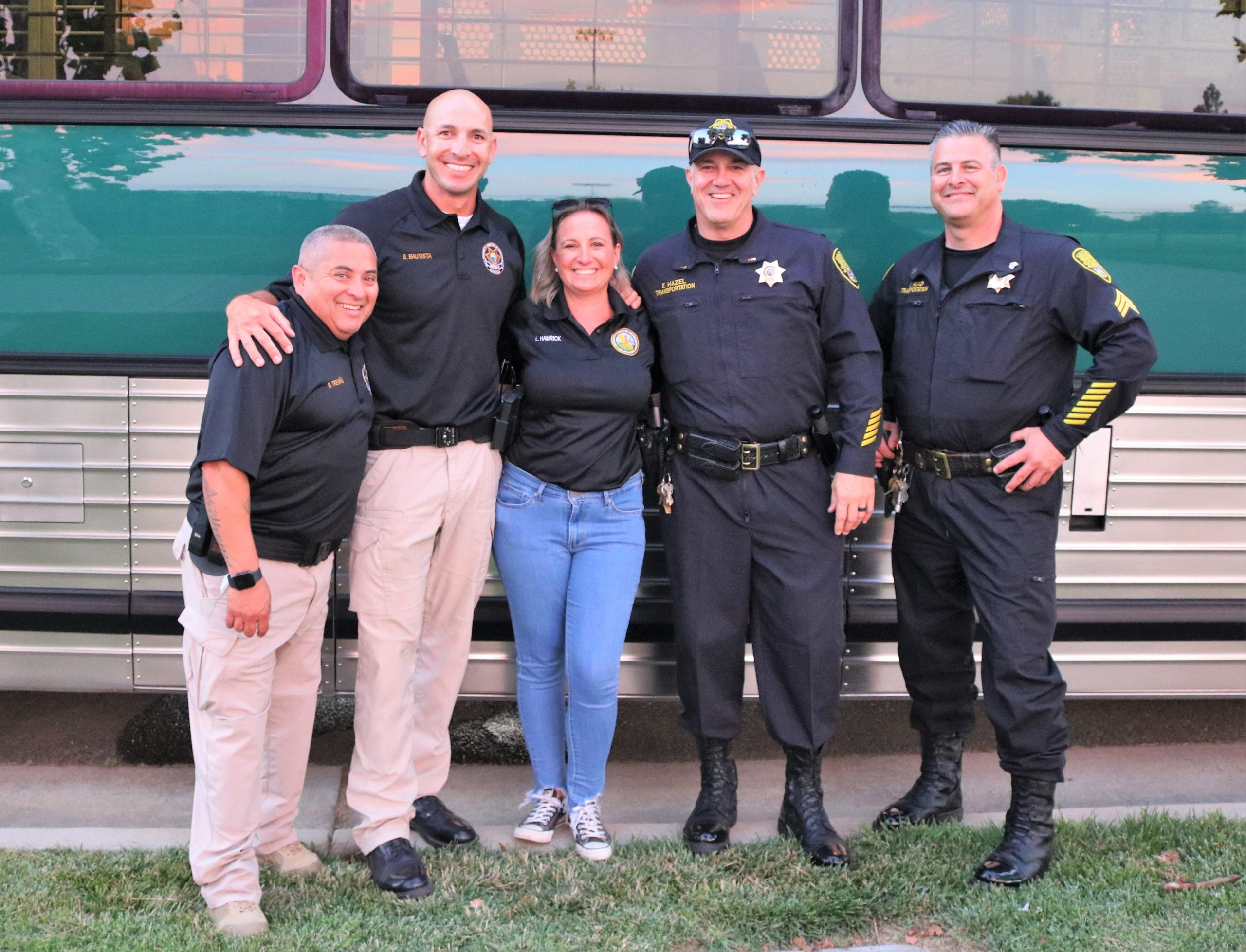 CDCR staff in front of a transportation bus at National Night Out.