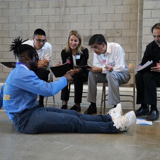 incarcerated sitting on the floor at VSP pitching Defy sales idea