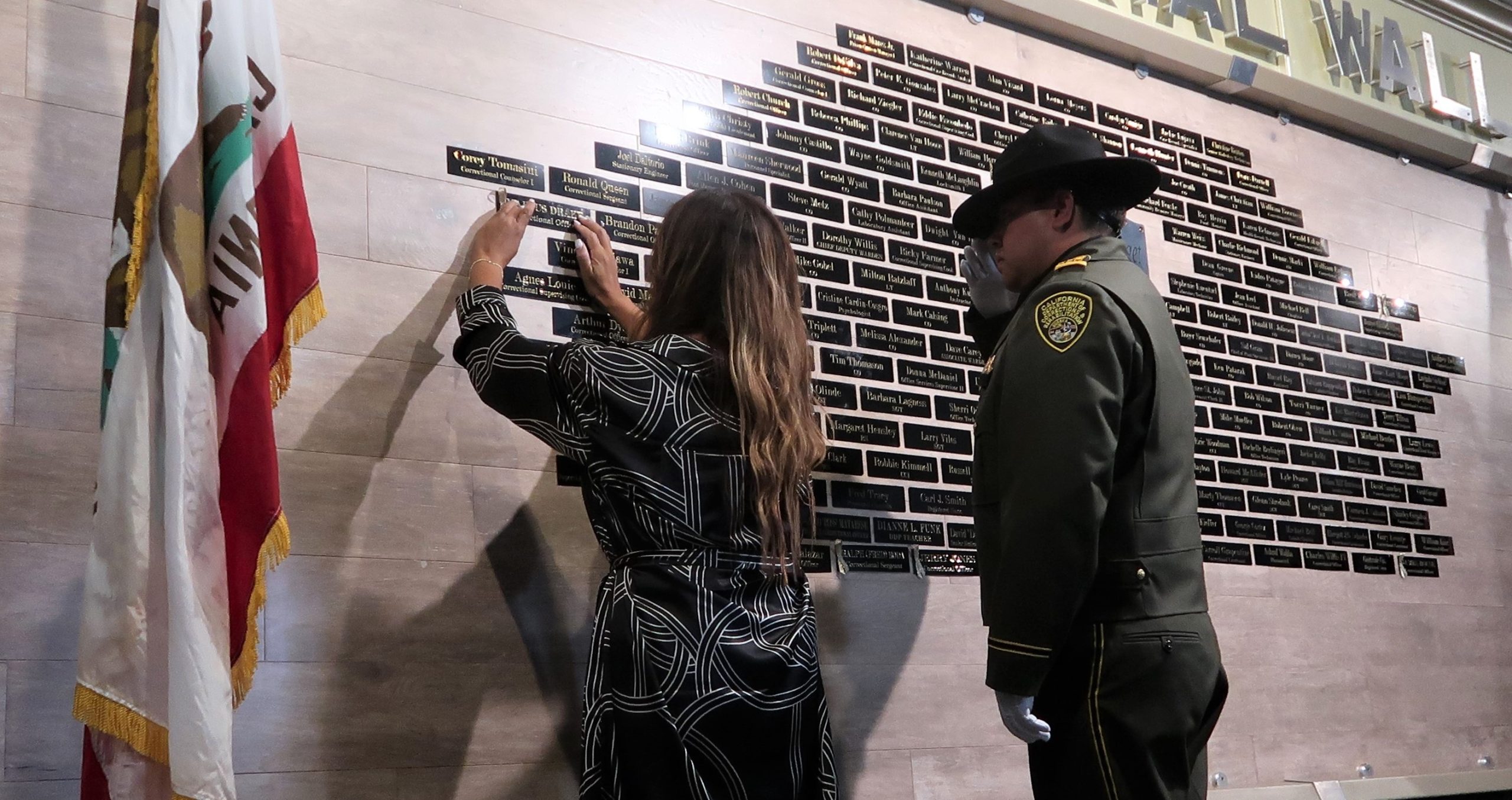 families hang their loved ones names on CMC Memorial Wall