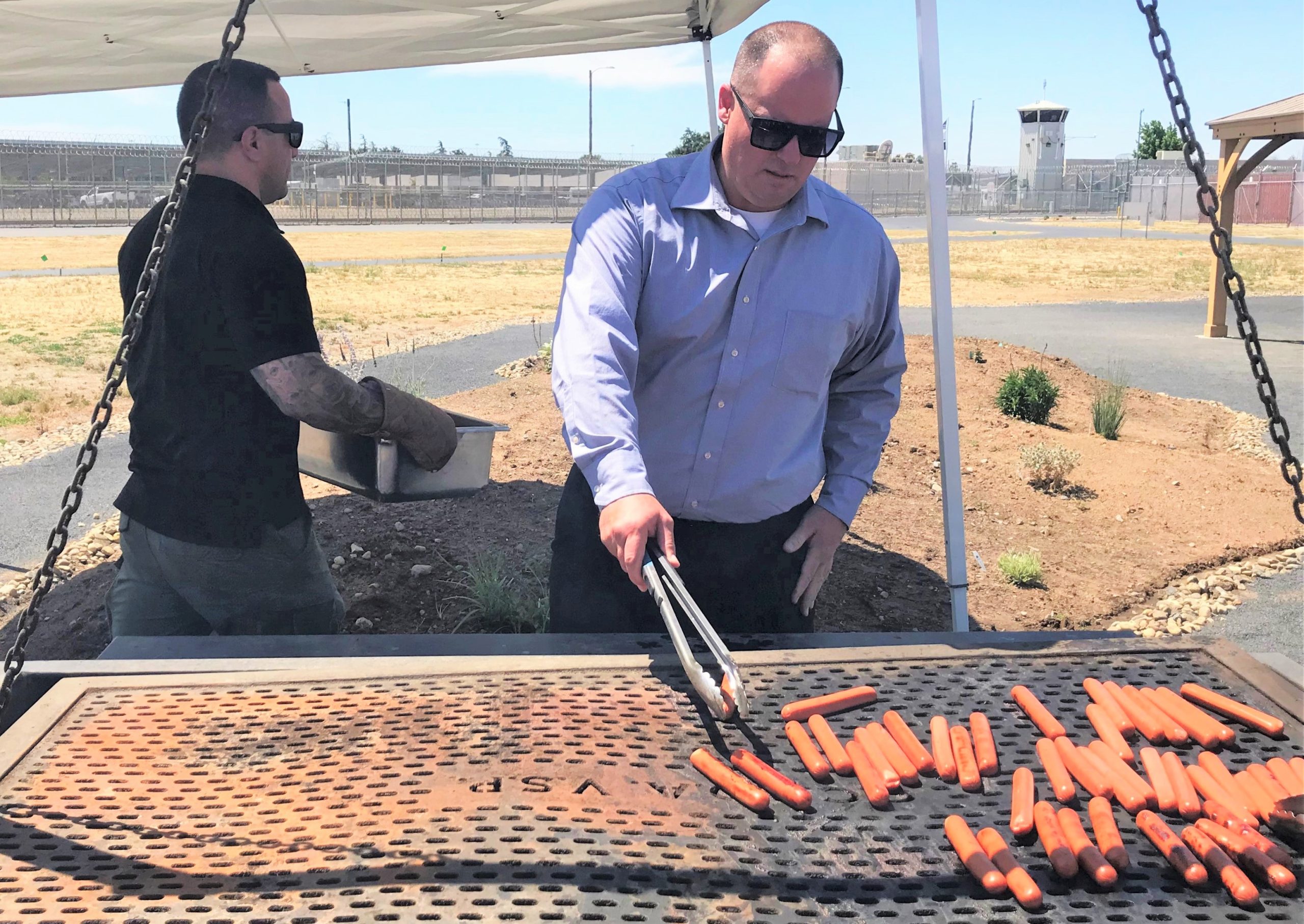 Valley State Prison (VSP) warden works the staff appreciation barbecue.