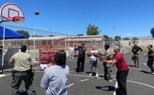 CIW staff playing basketball in observance of the fallen