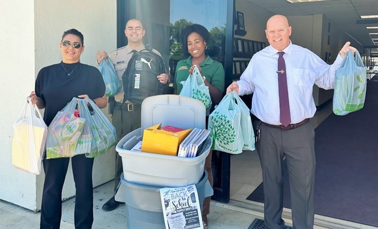 Corcoran prison staff with school supplies.