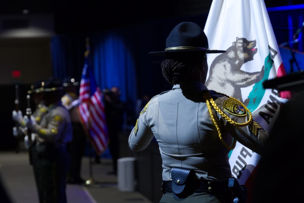 A closer look during the Medal of Valor as an Honor Guard member opens the California flag.