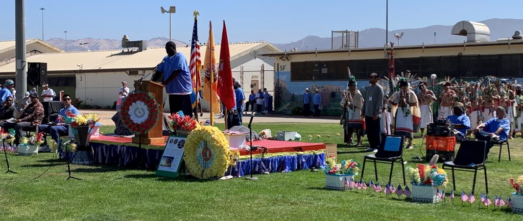 incarcerated speaking in front of audience as Navajo Code Talkers visit CTF