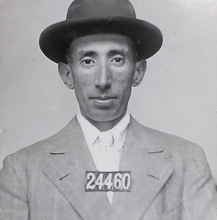 JC Ripley in 1910 with numbers 24460 wearing a hat, jacket and tie.