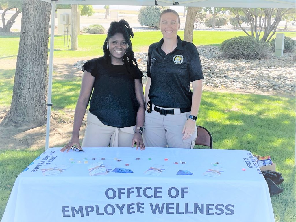 Two Avenal Prison staff members at an Employee Wellness booth.