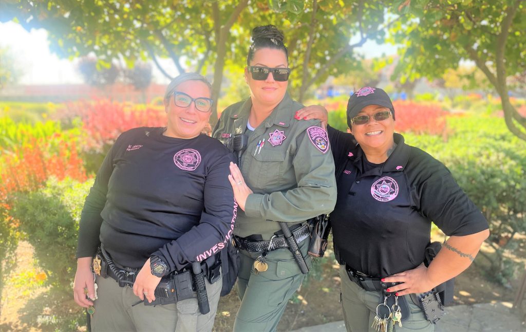Three VSP staff wearing pink patches.