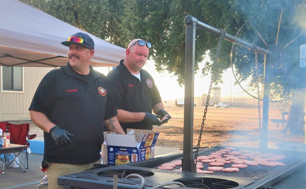 Grilling hotdogs and burgers at the VSP family night.