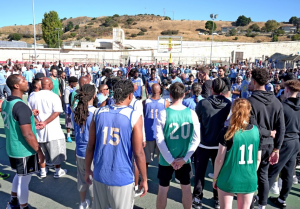dozens of people gathered at the San Quentin basketball court for the Warriors game